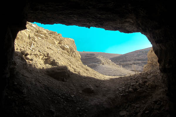 Looking out from a sandstone cave in Mukawir, Jordan